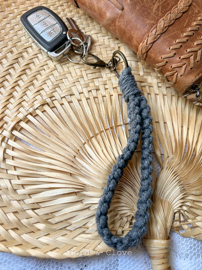 Macrame Keychain with car keys on a woven surface